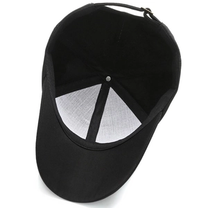 Inside view of black adjustable baseball cap showing six-panel cotton fabric and sweatband