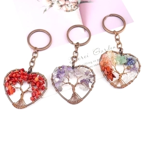 Three vintage heart-shaped tree of life keychains with natural colorful crystal stones