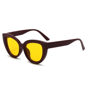 Retro cat-eye sunglasses with dark tortoise frame and yellow lenses in a 45-degree view