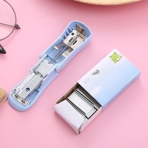 Mini blue stapler set with 24/6 staples and cute frog design on a pink background
