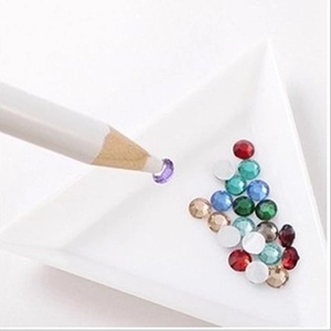 DIY rhinestone applicator pen with colorful multi-faceted gems and white sorting tray
