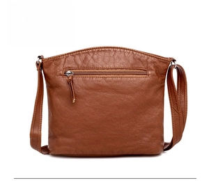 Rear view of brown litchi pattern leather bag showing a horizontal zipper pocket on the back