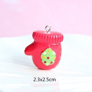 Detailed view of red resin glove charm with Christmas tree motif, size 2.3x2.5cm