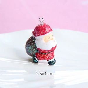 Macro view of Santa Claus resin pendant with glitter finish and size dimensions 2.5x3cm