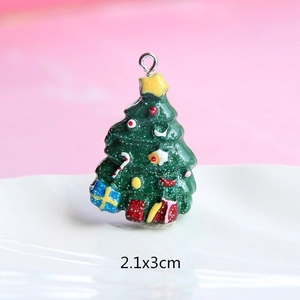 Detailed view of a green resin Christmas tree charm with glitter and 2.1x3cm dimensions