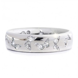 Polished silver ring with butterfly patterns and clear cubic zirconia stones on white background