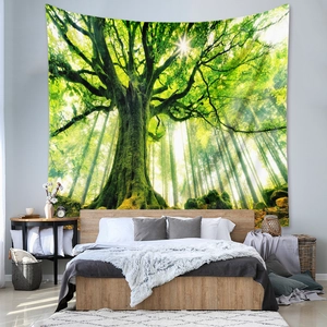Bedroom wall decor detail showing forest tapestry with golden sunlight through trees