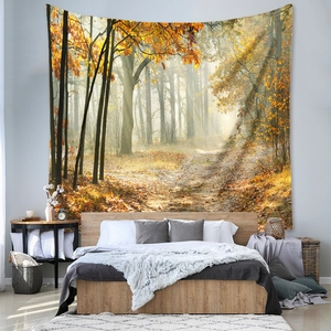 Detailed view of bohemian autumn forest wall tapestry with warm sunlight in a bedroom