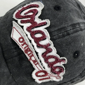 Macro detail of vintage washed cotton baseball cap with Orlando 01 3D embroidery textures