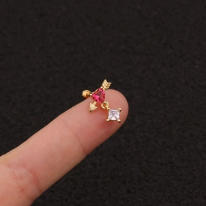 Golden heart arrow stud earring featuring pink and clear cubic zirconia stones