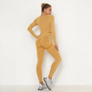 Detail view of seamless ginger yellow yoga set featuring high waist leggings and long sleeves