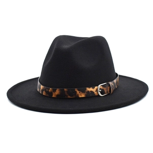 Detail of wide brim black wool fedora featuring a stylish leopard print band and silver buckle