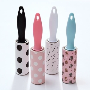 Set of four portable lint rollers with various patterns for efficient pet hair removal