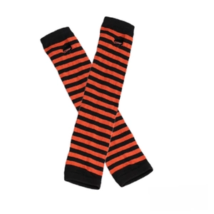 Detail of pumpkin orange and black striped knit arm warmers with thumb holes