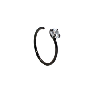 Close-up of black stainless steel C-shaped nose ring with a sparkling zircon gemstone