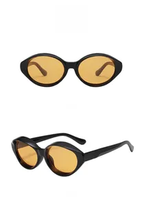 Front and side view of vintage cat-eye sunglasses with thick black frames and yellow lenses