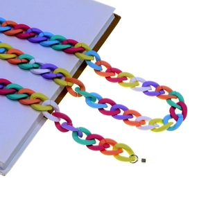 Matte Acryl Brillenkette mit bunten Makronen-Gliedern auf lila Notizbuch
