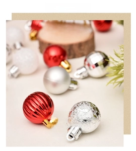 Detailed close-up of 3cm Christmas ornaments with red stripes and silver glitter spheres