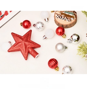 Close-up of red glitter tree topper and assorted 3cm ornaments in a festive gift set