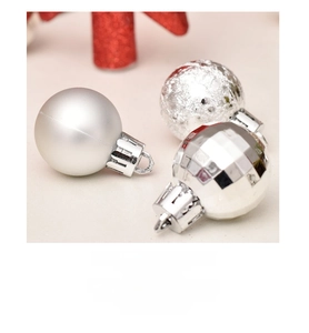 Detailed silver Christmas ball ornaments featuring matte, glitter, and disco mirror finishes