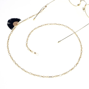 Golden eyewear chain with black fan tassels and silicone ends on white background