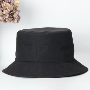 Detail of a black quick-dry bucket hat with sun protection and waterproof finish