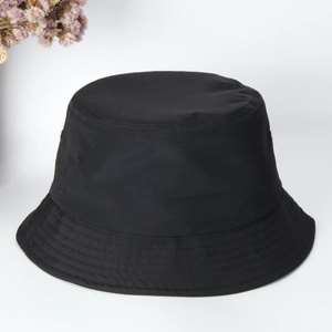 Detailed close-up of a black quick-dry bucket hat on white background with floral decor
