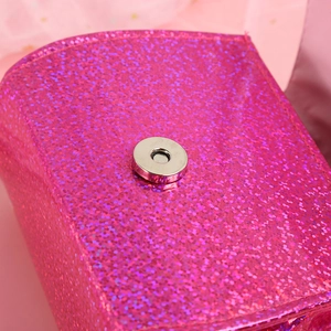 Pink glitter mini crossbody bag for kids with elegant pearl handle and magnetic closure