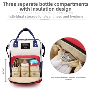 Detail of insulated front pocket with three aluminum foil milk bottle holders on diaper bag