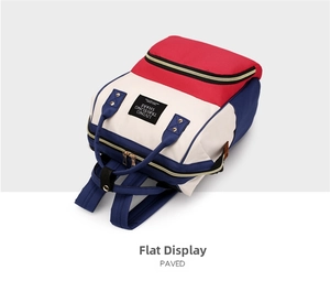 Three-color oxford cloth diaper bag showing zipper closure and durable top handles