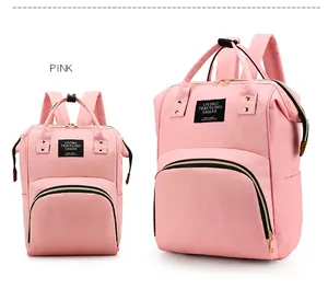 Front detail of pink Oxford cloth mummy bags with Living Traveling Share label