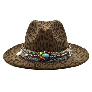 Detail of leopard print fedora hat featuring colorful beads and turquoise coin charm