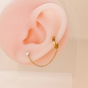 Golden stainless steel chain earring with zircon stud on silicone ear model