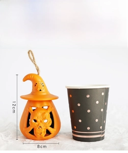 Detailed size comparison of resin Halloween pumpkin lantern with skeleton and witch hat