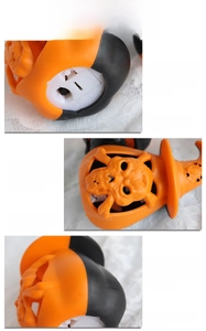 Detail of Halloween LED lantern showing bottom switch and hollow pattern mapping