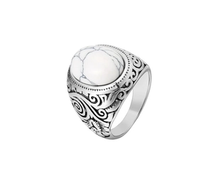 Macro detail of retro engraved stainless steel ring with white turquoise gemstone inlay