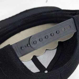Adjustable black cotton flat brim baseball cap with 7-hole plastic snapback closure