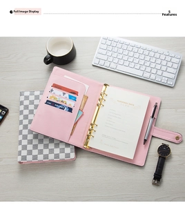 Pink A5 faux leather binder featuring 6-ring clips, functional card slots, and pen holder