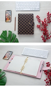 Detail of A5 brown checkered binder cover with pink interior and metal six-ring clips