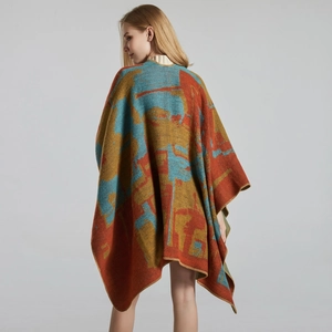 Macro detail of the colorful abstract pattern on a thick knitted women's poncho shawl