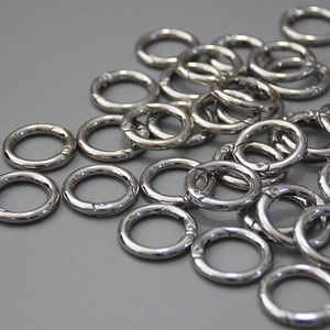 Close-up of polished silver spring O-rings for DIY bags and keychains hardware accessories