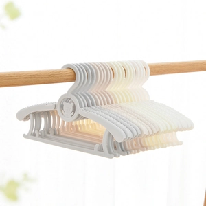Adjustable plastic baby hangers with bear pattern in soft pink and beige colors