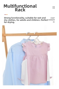 Detail of adjustable plastic kids hangers in pink and grey with cute bear relief design