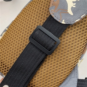 Detail of durable nylon strap, plastic buckle, and breathable yellow mesh on child backpack