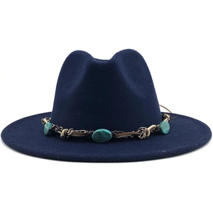 Detail of navy blue wool fedora hat featuring a bohemian turquoise stone woven band