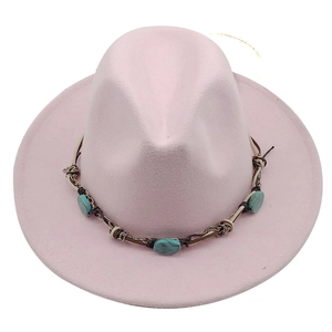 Detail of pink wool fedora with ethnic woven band and turquoise stone embellishments