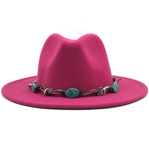 Detail of rose red wool fedora hat featuring bohemian turquoise beaded leather band