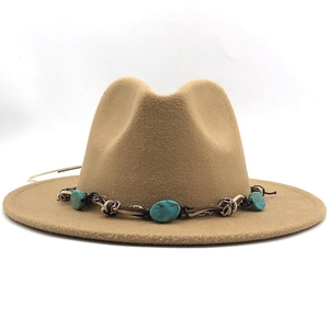 Detail of camel wool fedora hat featuring a vintage ethnic style turquoise beaded band