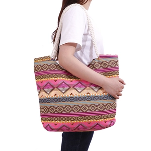 Large geometric canvas tote bag with colorful ethnic patterns and woven rope handles