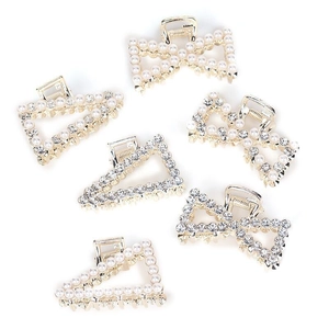 Golden hair clips set with sparkling rhinestones and elegant pearls in various shapes